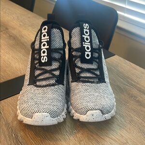 NEW, NEVER BEEN WORN. Big Boy size 5. Adidas Black and White Sneakers